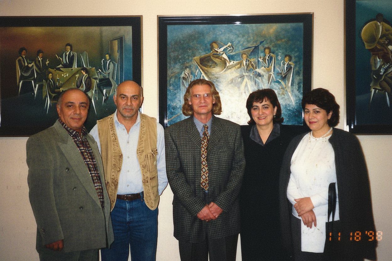 Mikael Jihann with guests at an exhibition of his paintings